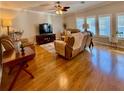 Cozy living room featuring hardwood floors, vaulted ceilings, and natural light at 272 S Port Royal Ln, Apollo Beach, FL 33572