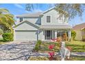 Charming two-story home with well-kept lawn and landscaping, located in a lovely neighborhood at 2944 Billingham Dr, Land O Lakes, FL 34639