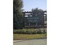 Welcome to Heritage Hills. Community sign nestled among lush greenery at 36562 Silver Maize Dr, Dade City, FL 33525