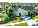 Aerial view of a well-maintained home with lush landscaping in a quiet residential neighborhood at 6002 Thrushwood Rd, Lithia, FL 33547