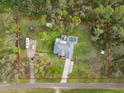 Birds eye view shows the property with an RV, boat and marked property line at 1126 Oxbow Rd, Wimauma, FL 33598