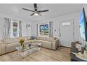 Spacious living room featuring neutral tones, contemporary furniture, and ample natural light at 164 Nw Lincoln N Cir, St Petersburg, FL 33702