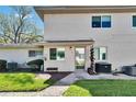 Close up exterior featuring well-maintained landscaping, exterior wall, door, and windows at 1832 Bough Ave # 3, Clearwater, FL 33760