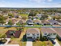 Aerial view of a well maintained community with playground, green spaces, and attractive homes at 248 Argyll Dr, Spring Hill, FL 34609