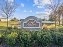 Stone community sign amidst lush green landscaping at 248 Argyll Dr, Spring Hill, FL 34609