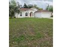 Charming single Gathering home features a manicured lawn and attached two car garage at 3292 Dow Ln, Spring Hill, FL 34609