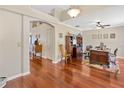 Spacious home office featuring hardwood floors, natural light, and a classic wooden desk at 703 June Lake Ln, Brandon, FL 33510