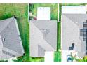 Aerial shot showcasing the roof and layout of a residential home with a well-maintained yard at 17113 Sunshine Mimosa St, Wimauma, FL 33598