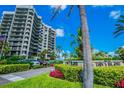 Lush landscaping at the entrance of Dan's Island, a luxury condominium complex near the beach at 1600 Gulf Blvd # 817, Clearwater Beach, FL 33767