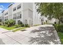 A view of the townhome complex, showcasing the well-maintained landscaping and architecture at 224 S Audubon Ave, Tampa, FL 33609