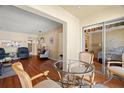 Open dining area leading to the living room and sliding glass doors to the balcony at 7701 Starkey Rd # 526, Seminole, FL 33777