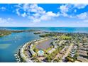 Aerial view of waterfront condo community with stunning water views and a pool, perfect for relaxation at 113 Seahorse Se Dr # D, St Petersburg, FL 33705