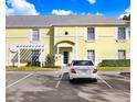 Exterior shot showcasing the home's architectural details, windows, and parking in front of the building at 113 Seahorse Se Dr # D, St Petersburg, FL 33705