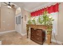 Cozy entryway featuring an ornate table adorned with plants and a decorative arched doorway at 11434 Minnieola Dr, New Port Richey, FL 34654