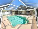 Inviting screened-in pool area perfect for relaxation and outdoor enjoyment at 1227 Big Creek Dr, Wesley Chapel, FL 33544