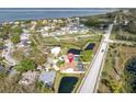 Aerial shot showcases the property's proximity to the water and nearby community amenities at 1996 Promenade Way, Clearwater, FL 33760