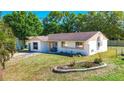 Side view of well-maintained single-story home with fresh landscaping and a healthy green lawn at 2721 Stratford Dr, Sarasota, FL 34232