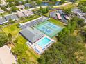 Aerial view of community pool, tennis courts and clubhouse at 3005 Brookfield Ln, Clearwater, FL 33761