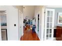 Inviting foyer with hardwood floors, leading to a spacious living area at 3639 Darston St, Palm Harbor, FL 34685