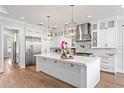 Spacious kitchen with a large center island, stainless steel appliances, and modern lighting at 4614 W Lowell Ave, Tampa, FL 33629