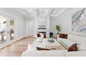 Bright living room with a fireplace, hardwood floors, and access to the outdoors at 4614 W Lowell Ave, Tampa, FL 33629