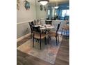 Cozy dining area featuring a circular table with seating for four at 5553 Baywater Dr Dr # 121, Tampa, FL 33615