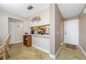 A welcoming entryway with tiled floors, adjacent to the kitchen and decorated with stylish accents at 6357 Bahia Del Mar Blvd # 206, St Petersburg, FL 33715