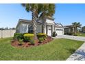 Charming single-story home with manicured lawn and garden in a desirable neighborhood at 8766 Shadyside Ln, Land O Lakes, FL 34637