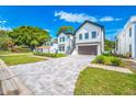 Charming two-story home featuring a modern design and a neatly paved driveway at 1741 Nevada Ne Ave, St Petersburg, FL 33703