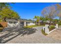Beautiful single-story home with well-maintained yard and curved driveway at 2117 S West Shore Blvd, Tampa, FL 33629