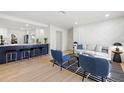 Modern living room with a cozy seating area, open to the kitchen and bar seating at 2117 S West Shore Blvd, Tampa, FL 33629