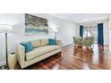 Open concept living and dining area with hardwood floors and lots of natural light at 2124 Crowsnest Dr, Palm Harbor, FL 34685