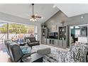 Cozy living room featuring plush seating, a ceiling fan, and a view to the outside patio at 3003 Magdalene Woods Dr, Tampa, FL 33618