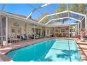 Sparkling pool surrounded by an expansive patio, perfect for outdoor entertainment and relaxation at 3003 Magdalene Woods Dr, Tampa, FL 33618