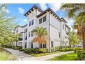 Beautiful three-story condo with manicured landscaping, showcasing its architectural details and curb appeal at 5120 Bridge St # 6, Tampa, FL 33611