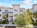 Well-maintained condo with neutral palette, features covered balconies and mature trees along sidewalk at 5120 Bridge St # 6, Tampa, FL 33611