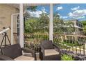 Cozy balcony seating area offers a relaxing outdoor space with neighborhood views at 2308 W Jetton Ave, Tampa, FL 33629