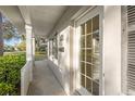 Inviting front porch with bright, natural light coming in the main door and front windows at 2819 Boca Ciega N Dr, St Petersburg, FL 33710