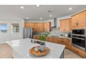 Bright kitchen with stainless steel appliances, a large island, and light wood cabinetry at 28889 Orange Berry # Dr, Wesley Chapel, FL 33543