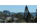 Scenic water view framed by lush trees and residential buildings in the distance at 2960 59Th S St # 501, Gulfport, FL 33707