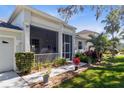 Inviting front porch featuring comfortable seating and decorative plants, creating a cozy entrance at 3629 Mossy Oak Cir, Land O Lakes, FL 34639