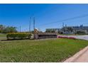 East Lake Woodlands community sign with manicured landscaping at 370 S Woodlands Dr, Oldsmar, FL 34677