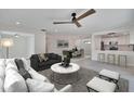 Bright, open-concept living room flowing into the dining area and kitchen, perfect for modern living at 370 S Woodlands Dr, Oldsmar, FL 34677