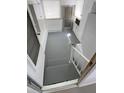 View of the utility area with washer, dryer, storage and staircase at 4851 W Gandy Blvd # B1L14, Tampa, FL 33611
