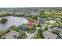 This aerial view showcases the home's lakeside location and community at 540 Somerhill Ne Dr, St Petersburg, FL 33716