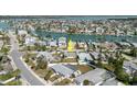 Aerial view highlighting the home's location, private pool, and proximity to the waterfront community at 596 S Bayshore Dr, Madeira Beach, FL 33708