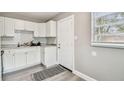 Well-lit kitchen boasts modern appliances and ample counter space at 803 W Warren St, Plant City, FL 33563