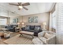 Comfortable living room with sofa, decorative pillows, and a large mirror creating an open feel at 8220 112Th N St # 206, Seminole, FL 33772