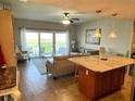 Open concept living room that leads to a patio with spectacular ocean views at 880 Mandalay Ave # N802, Clearwater Beach, FL 33767