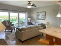 Living room features stylish furnishings and direct access to the private balcony at 880 Mandalay Ave # N802, Clearwater Beach, FL 33767